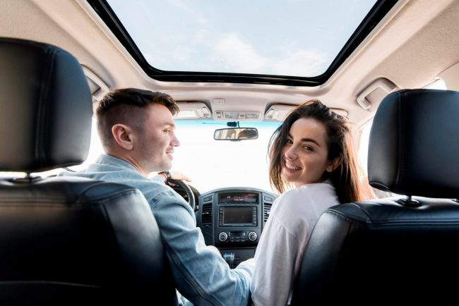 CoupleCar3 Photo of couple in car illustrates blog: "Collision vs Comprehensive Insurance Coverage: What Is the Difference?"