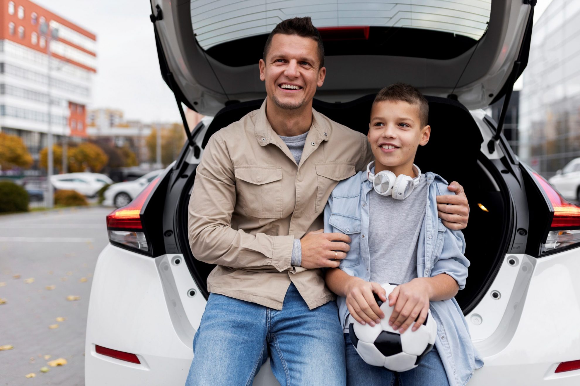 Photo of man in car with his son illustrates blog: "Who Needs Umbrella Insurance?"