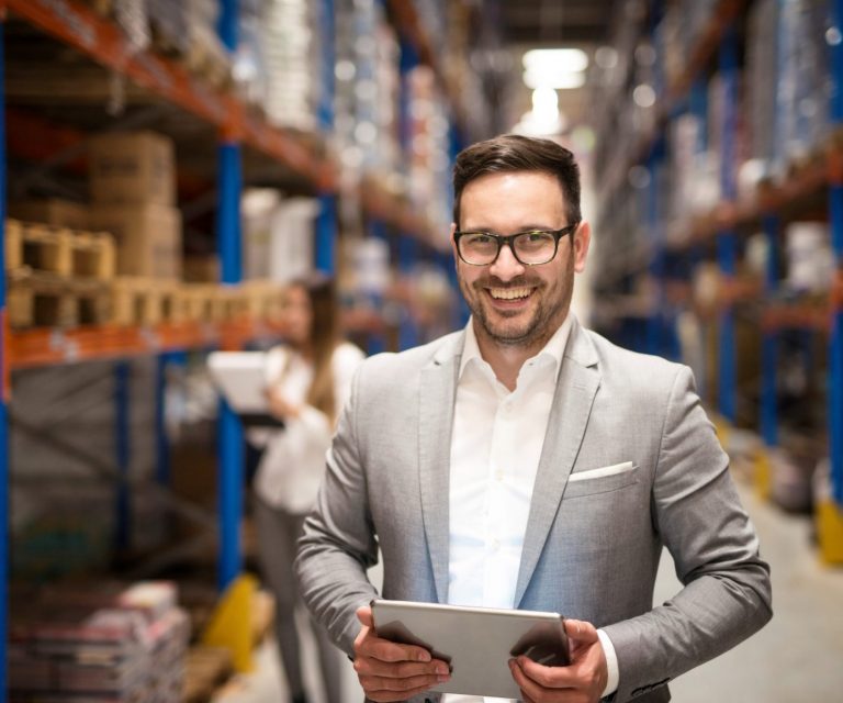 Photo of entrepreneur in warehouse illustrates blog:"How to know if your business needs Inland Marine Insurance"