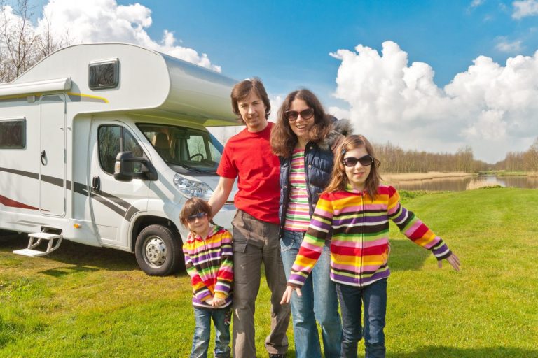 Photo of family with motor home illustrates blog "4 tips to save on Recreational Vehicle Insurance"