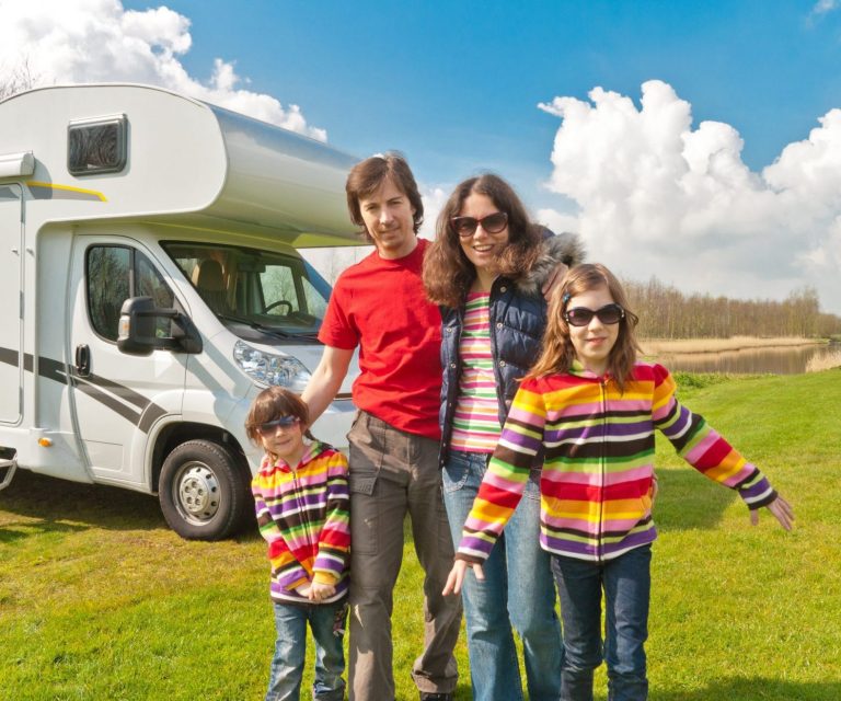 Photo of family with motor home illustrates blog "4 tips to save on Recreational Vehicle Insurance"