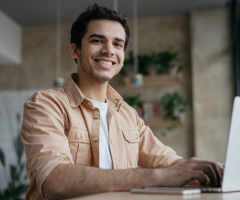Photo of smiling man illustrates blog: "What is and isn't covered by your homeowners insurance"