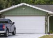 Photo of garage with pickup truck in the driveway